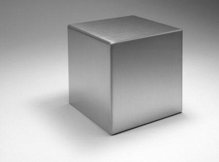 studio photography of a solid metal cube in light backの写真素材