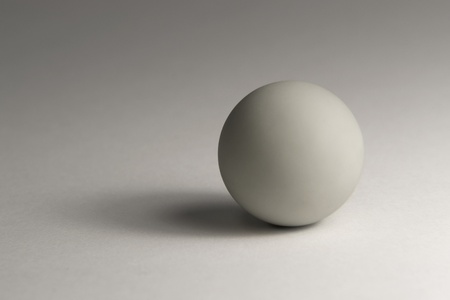 studio photography of a grey ball in light backの写真素材