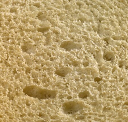 full frame abstract detail showing a porous slice of bread