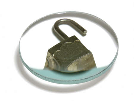 security theme with a open padlock under a optical lens in white back with clipping pathの写真素材