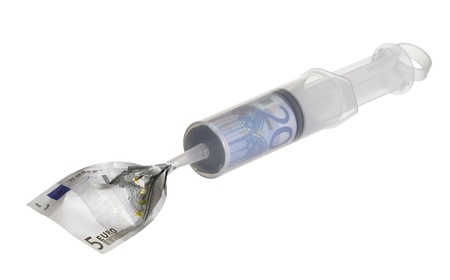 symbolic financial crisis theme with a big syringe filled with euro money, isolated on white with clipping pathの写真素材