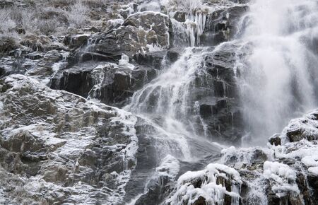 detail of a waterfall near Todtnau, a town in the Black Forest in Germany at winter timeの写真素材