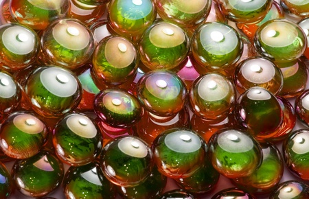 full frame abstract background picture with iridescent glass beads