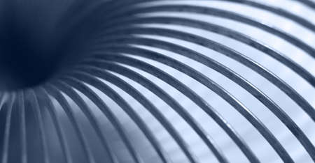 abstract industrial background showing a blue toned detail of a metallic spiralの写真素材