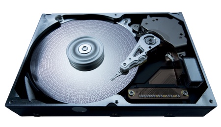 symbolic studio photography showing the detail of a opened hard disk, blue toned