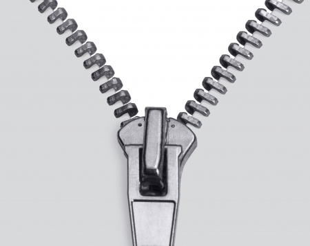 studio photography showing the detail of a zipper in light backの写真素材