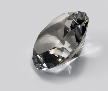 studio photography of a clear glass diamond in light back with clipping pathの写真素材