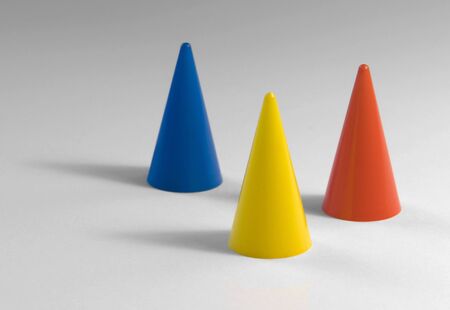 studio photography of three colored tapers in light backの写真素材