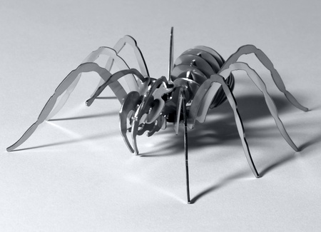 artwork of a symbolic metal spider in light backの写真素材