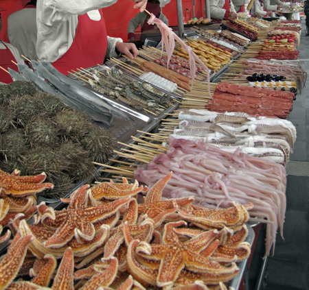 detail of a chinese market stall with lots of strange food in Beijing (China)のeditorial素材