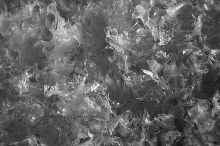 abstract background with translucent plastic flakesの写真素材