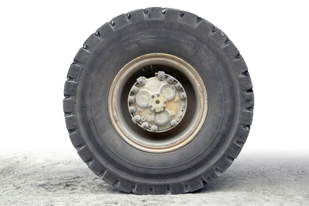 rundown dump truck wheel in gradient isolated muddy backの写真素材