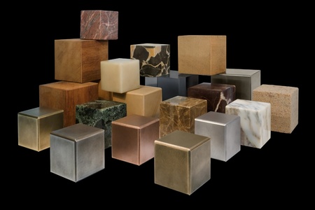 lots of various cubes made of different materials in black back