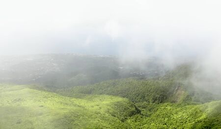 high angle foggy scenery at a caribbean island named Guadeloupeの写真素材