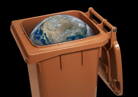 symbolic scenery showing a globe in a open waste container