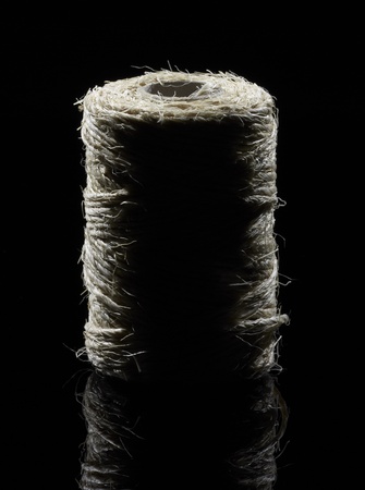 coil of yarn in dark backの写真素材