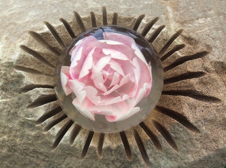 detail of a carved stone with cast in flower headの写真素材