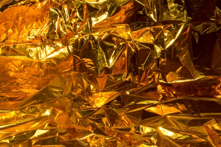 full frame creased gold foil backgroundの写真素材