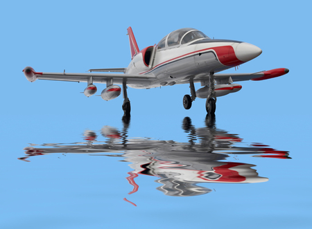 Aero L-39 Albatros and reflective water surface in blue backの写真素材