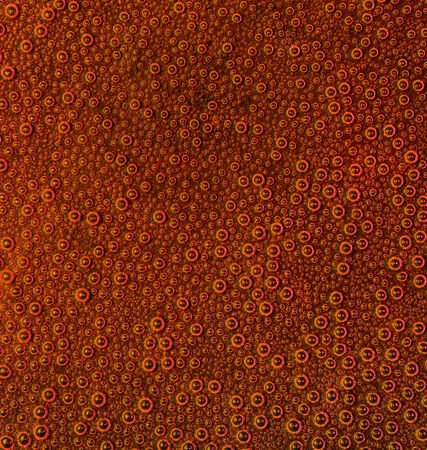 full frame abstract underwater background with lots of small air bubbles in red ambiance