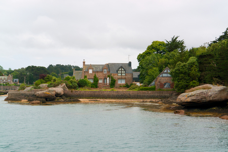 waterside scenery with houses around Perros-Guirec at the Pink Granite Coast in Brittany, Franceの写真素材
