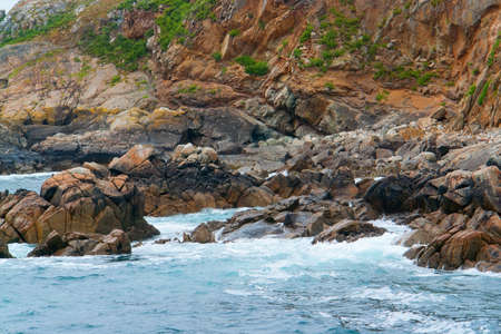 rocky and clefty coastal detail at the Seven Islands in Brittany, Franceの写真素材