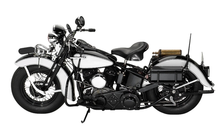 sideways shot of a vintage motorbike in white backの写真素材