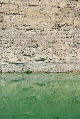 sunny scenery with lake at a gravel quarry in Southern Germanyの写真素材