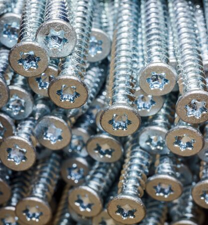 full frame background showing lots of long screws