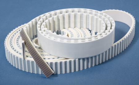 a white rolled drive belt in blue back