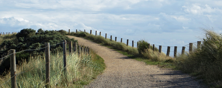 coastal scenery including a dike with path in the Netherlandsの写真素材