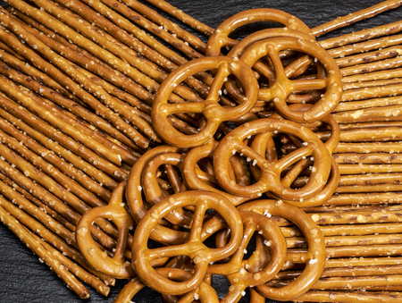 closeup of some salt sticks and pretzels in dark backの写真素材