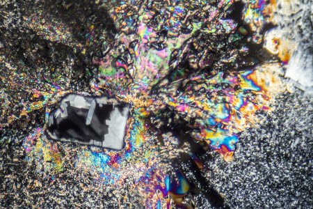 macro shot of growing microcrystals of soda lye in polarized lightの写真素材