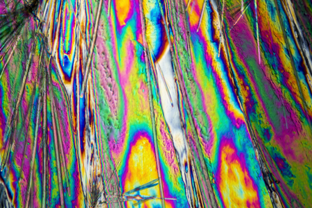 microscopic shot of Sodium carbonate microcrystals in polarized lightの写真素材