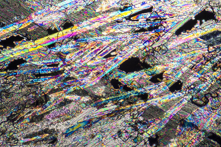 colorful microscopic shot of liquid fertilize microcrystals in polarized lightの写真素材
