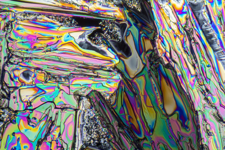 colorful microscopic shot of Sodium nitrate microcrystals in polarized lightの写真素材