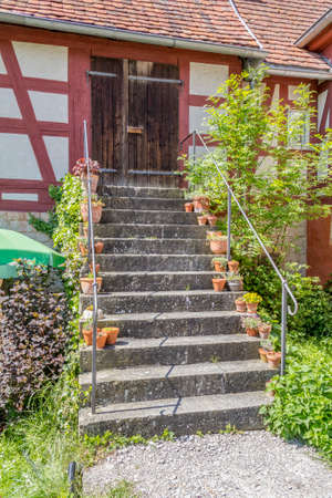 entrance of a historic rural building in sunny ambianceの写真素材
