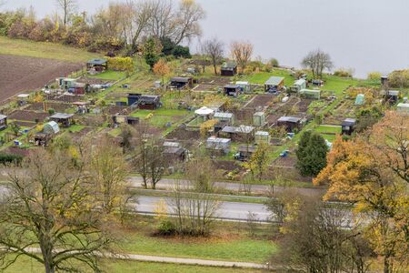 high angle view showing lots of allotment gardens near Danube river at autumn timeの写真素材