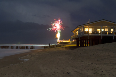 coastal scenery at night including some fireworks at the beach near Domburg in Zeelandの写真素材