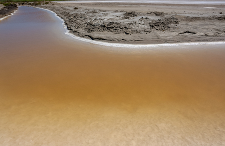 scenery around Salin-de-Giraud located in in the Camargue area in southern France wich is showing lots of salt evaporation ponds in sunny ambianceの写真素材