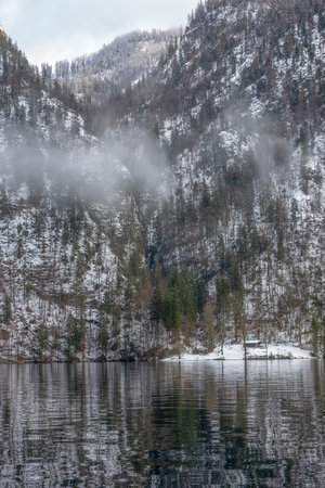 riparian scenery at a lake named Koenigssee located in the Berchtesgadener Land in Bavaria (Germany) at winter timeのeditorial素材