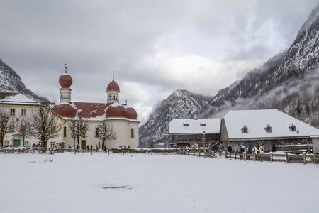 scenery around St. Bartholomews Church at the Koenigssee lake in Bavaria at winter timeの写真素材