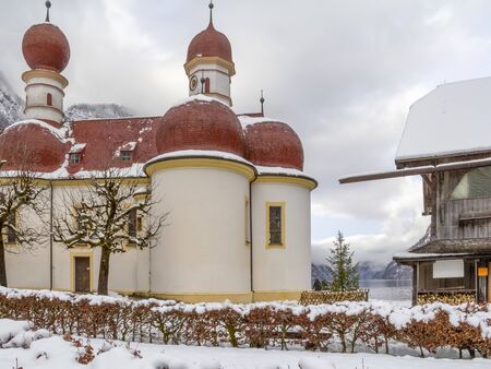 scenery around St. Bartholomews Church at the Koenigssee lake in Bavaria at winter timeの写真素材