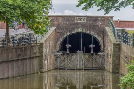 historic sluice in Greetsiel, a idyllic village located in East Frisia, Northern Germanyの写真素材