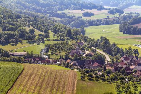 aerial view of a village named Baechlingen in Hohenlohe, Germany at late summer timeの写真素材