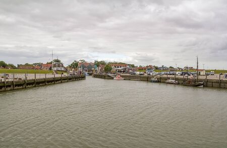 Fishing village named Neuharlingersiel located in East Frisia, Germanyの写真素材