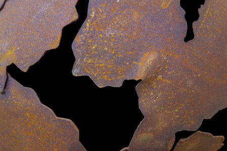 rusty corroded metal pieces in black backの写真素材