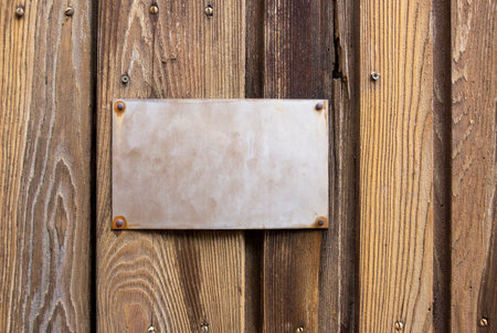 old metallic sign on wooden boardの写真素材