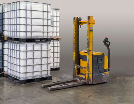 old pallet jack gradient isolated in industrial ambianceの写真素材