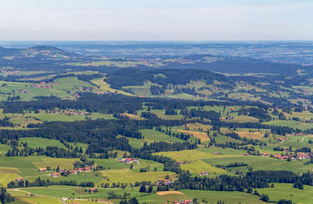 Idyllic aerial view seen from the Immenstaedter Horn around Immenstadt at the Allgaeu region in...